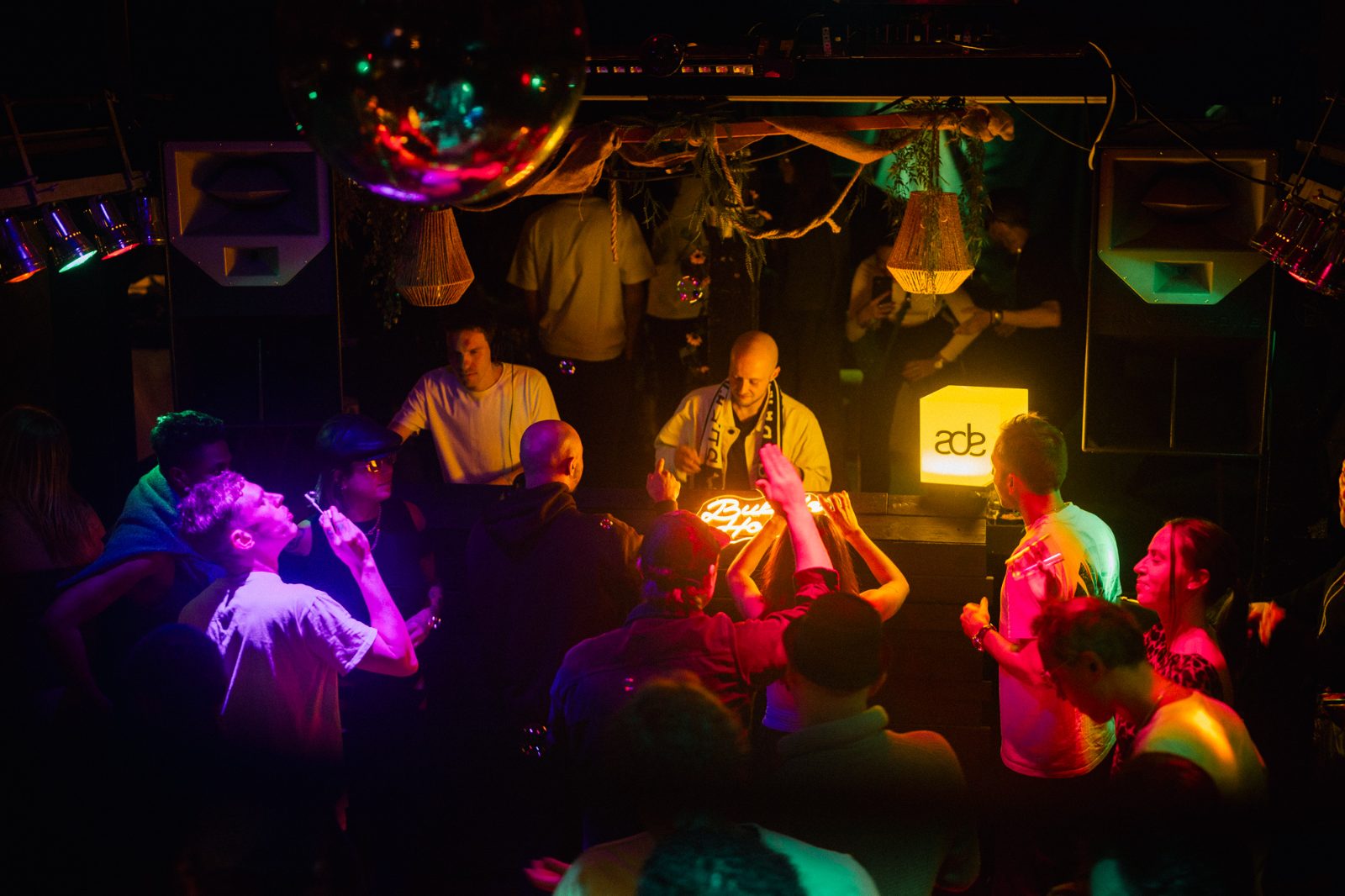 Electronic music artist performing for a club audience